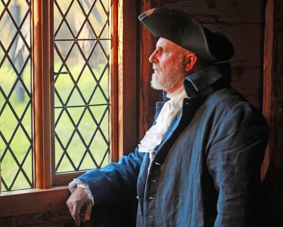 man looking out window. Photo by Rory MacNish